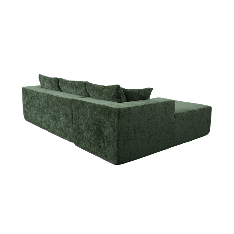 Sofá modular de canto em formato de L em veludo verde esmeralda com várias almofadas Sofá modular de canto em formato de L em veludo verde esmeralda com várias almofadas