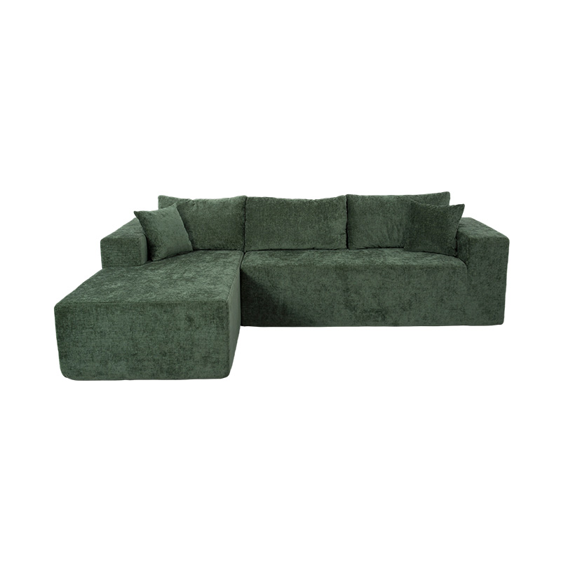 Sofá modular de canto em formato de L em veludo verde esmeralda com várias almofadas Sofá modular de canto em formato de L em veludo verde esmeralda com várias almofadas
